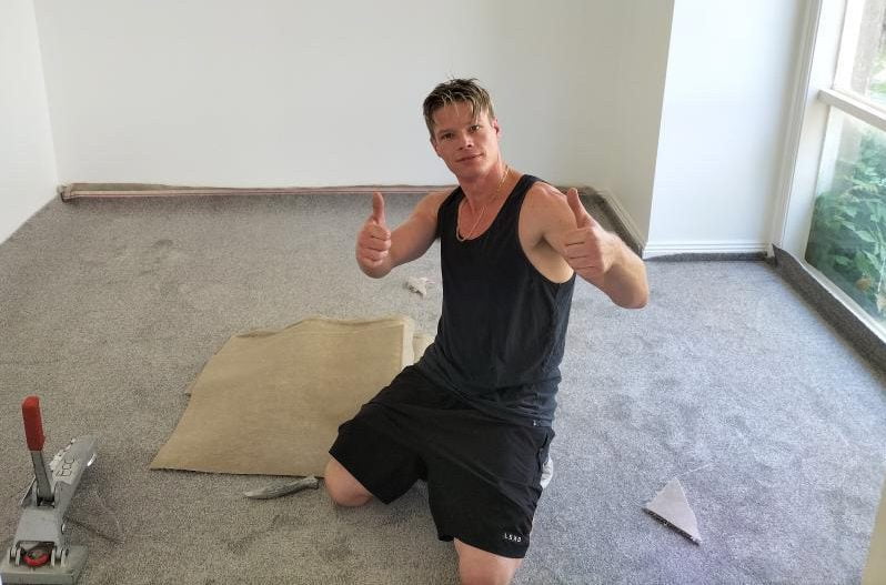Martin laying carpet